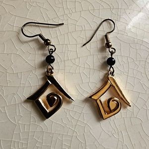 Unicef signed abstract geometric triangle swirl Egyptian revival dangle earrings